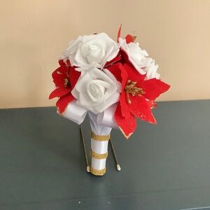 Red poinsettia and rose wedding bouquet